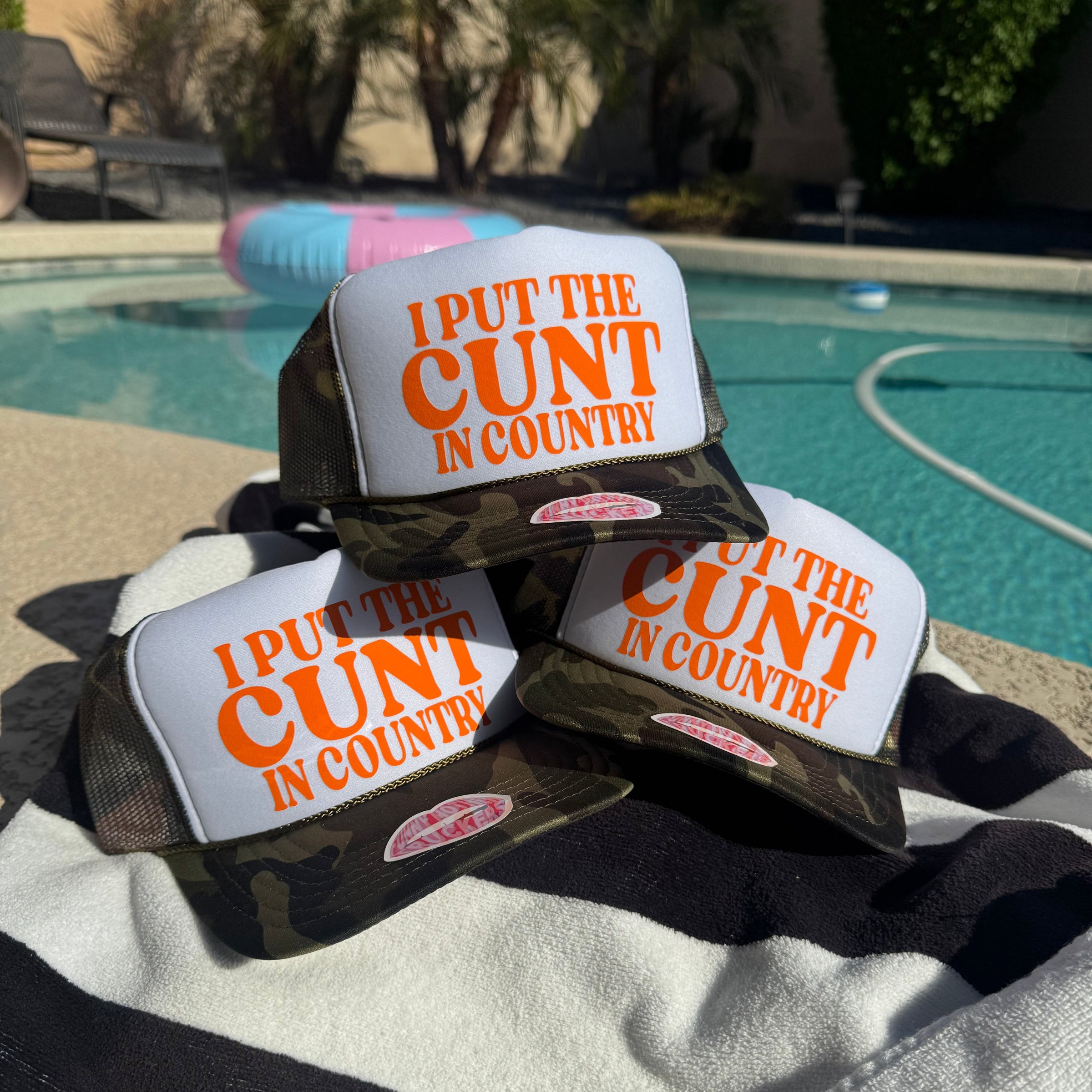 Camouflage trucker hat with 'i Put the Cunt in  Country