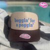 BEGGIN FOR A PEGGIN TRUCKER HAT
