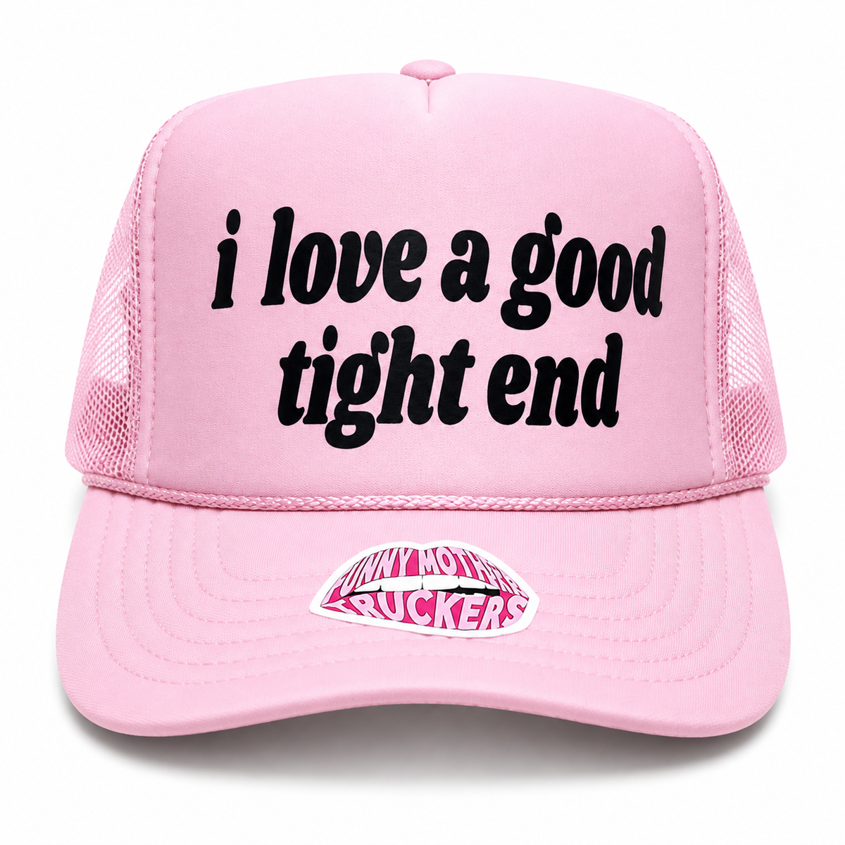 A light pink trucker hat with black embroidered text reading 'i love a good tight end' on the front panel and a pink and white 'Jelly Hornets Buckers' patch on the brim, shown against a plain white background.
