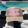 LINGERING FOR A FINGERING TRUCKER HAT